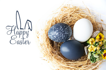 Multi-colored Easter eggs in nest on wooden background, selective focus image. Happy Easter card 