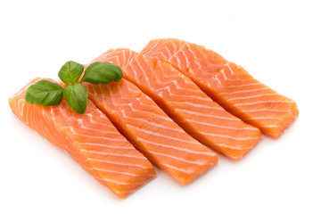 Fresh salmon fillet with basil on the white background.