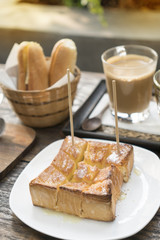 Bakery bread on wooden table on dark background.
