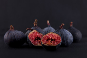 fresh ripe figs, rustic food photography on slate plate kitchen table can be used as background