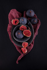 fresh ripe figs, rustic food photography on slate plate kitchen table can be used as background