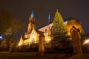 Fototapeta na wymiar Romanesque brick Catholic church at night in Poznan.