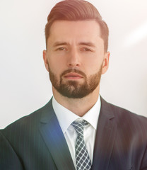 Portrait of a businessman with a woman in the background