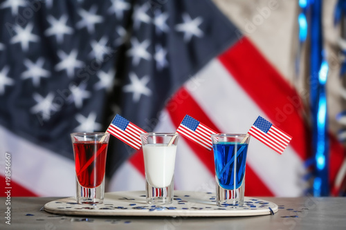 Shots with American flags on table against blurred background