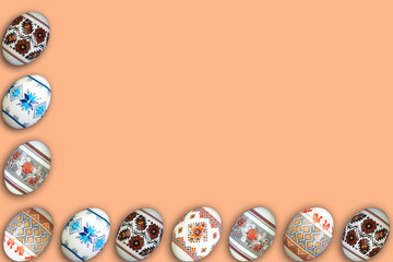 Happy Easter card. Colorful shiny easter eggs on beige background. Copy space for text.