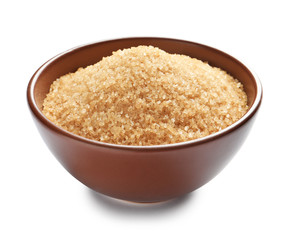Bowl with brown sugar on white background
