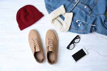 Composition with stylish men's shoes on light background