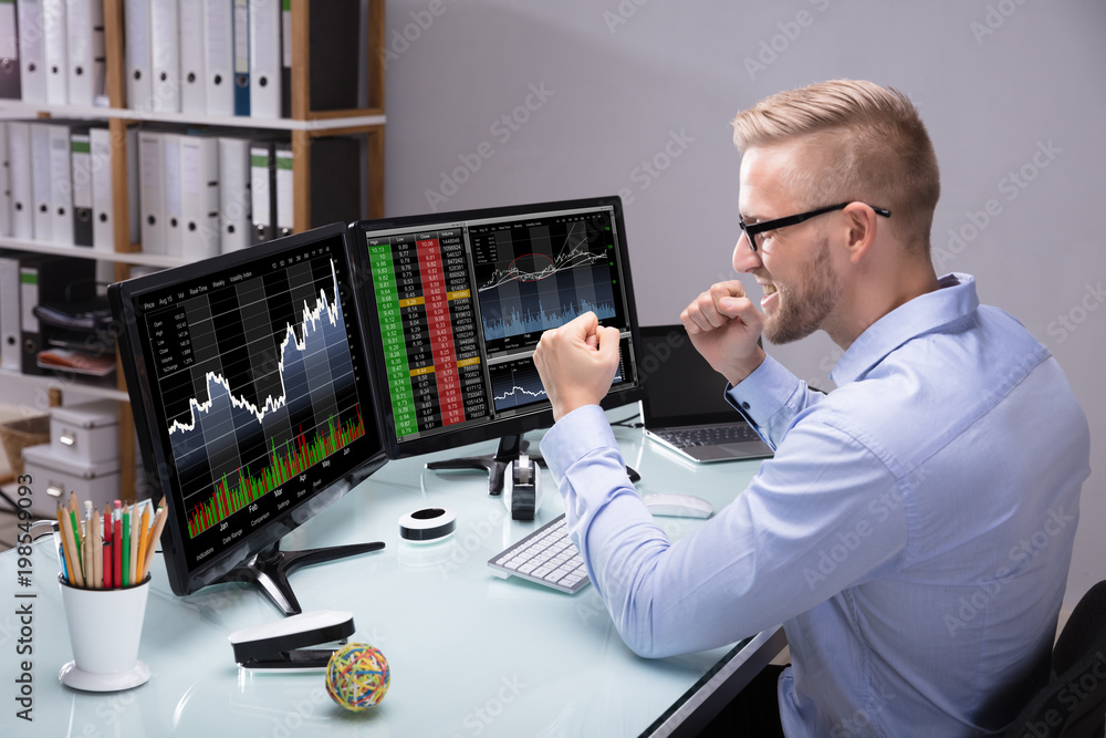 Poster excited stock market broker looking at graph on computer