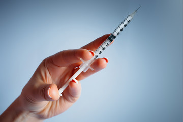 insulin syringe in the hand