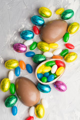 Different sweet chocolate and candy eggs, Easter concept