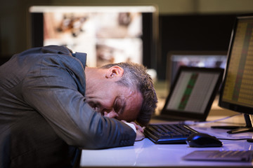 Tired Businessman Sleeping In Office