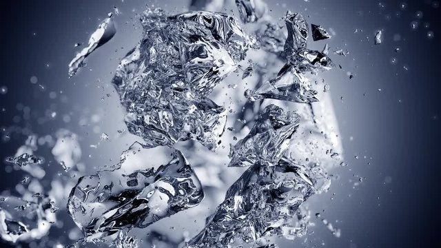 Exploding ice cube in slow motion with animated depth of field on blue gradient background. Cg animation.