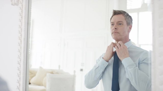 Handsome Male Getting Ready In The Morning In Front Of The Mirror