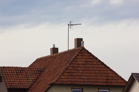 antenna on rooftop of a historical vintage building