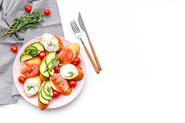 Mini sandwich set with french baguette, cheese, fish and avocado on white background top view mock up