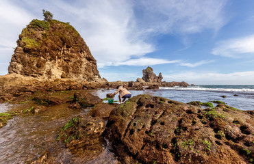 Fototapeta na wymiar Amazing view of Yogyakarta seascape with natural coastal rock as foreground