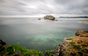 Amazing view of Yogyakarta seascape with natural coastal rock as foreground