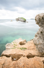 Amazing view of Yogyakarta seascape with natural coastal rock as foreground