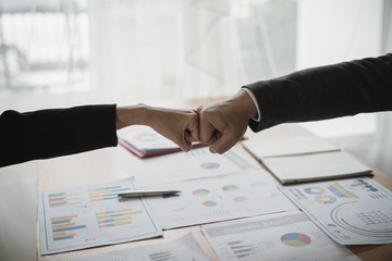 Fist bump. Hand of business men and women for working the job success, Hand coordination, symbolizing the hands to unity and teamwork, meeting, helps , business concept.