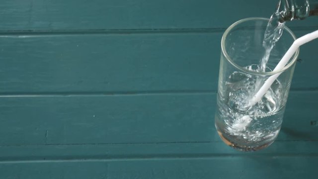 pouring drinking water into glass