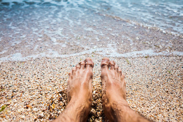 Feet in the sea water.