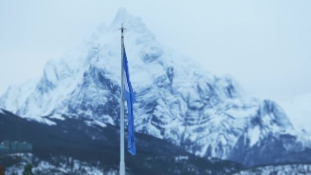 Argentine Flag with Mount Olivia, in Ushuaia (Argentina). Winter Shot. 