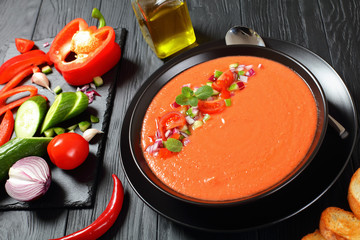 gazpacho in a black bowl, top view