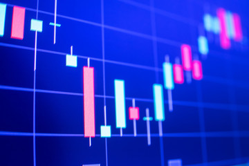 Stock market graph analysis. Stock market data on LED display on laptop screen for finance and economic. Business graph background.