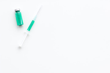 Syringe with medicine. Injection concept on white baclground top view copy space