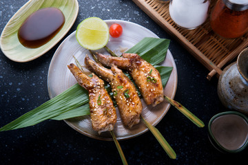 Grilled chicken wings with teriyaki sauce.