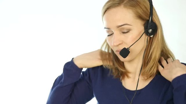 tired call center representative talking on helpline, Headset telemarketing female call center agent at work. slow motion