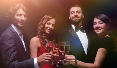 Cheerful people celebrating a sucess with Champagne