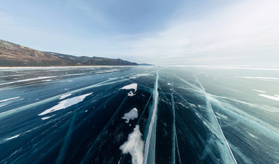 Panorama cracks on blue ice of Lake Baikal from Olkhon