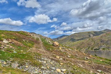 road stones mountains sky summer