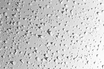 Drops of water with shadow on white background