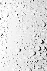 Drops of water with shadow on white background