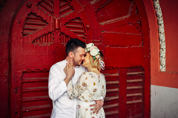 Fototapeta premium Beautiful couple holding tight and kissing