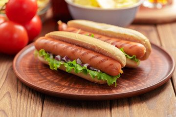 Hot dogs on wooden background