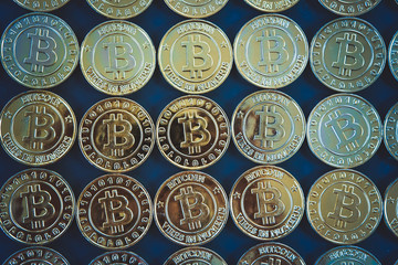 Golden bitcoins with selective focus .New virtual money.