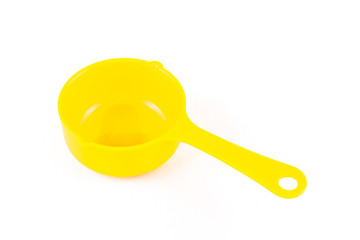 Measuring spoon or cup over the white background.