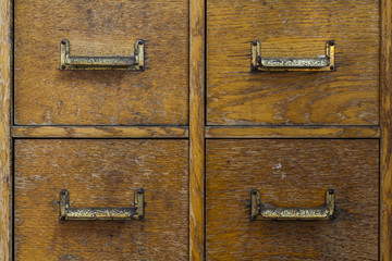 Old rustic cabinet with small compartments