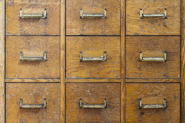 Old rustic cabinet with small compartments