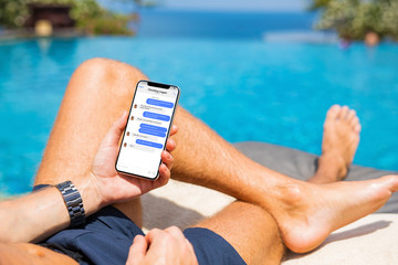 Man chat with friends on mobile phone