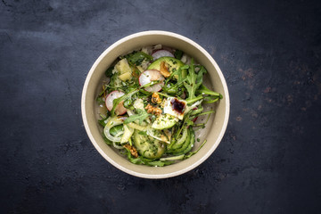 Traditional Germen lettuce with rocket salad and vegetable as top view on a plate with copy space