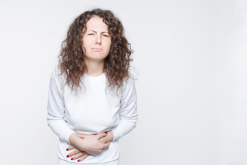 Food poisoning, nausea and sickness concept. Portrait of young female tourist feeling stomach ache,...