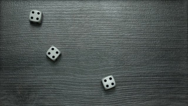 Poker Dice rolling three of a kind on four