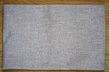 Linen fabric surface on wooden table for mock-up or designer use, book cover sample - 198582205