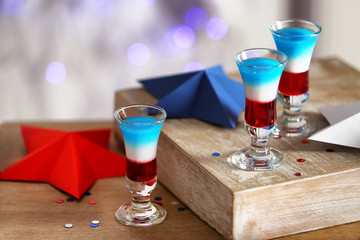 Layered cocktails in colors of American flag on table