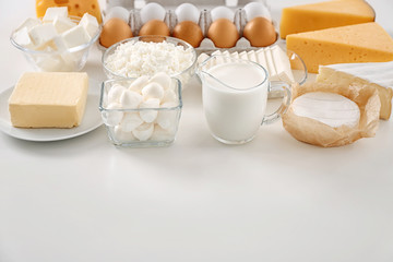 Fresh dairy products and eggs on white background