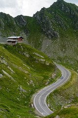 Transfagarasan mountain road with small building on rock, Romanian Carpathians